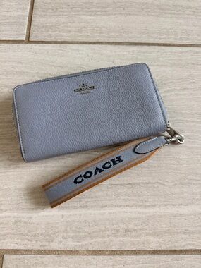 Coach Pebbled Leather Zip Wallet in baby blue with Branded Wrist Strap